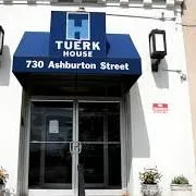 Tuerk House Howard House logo